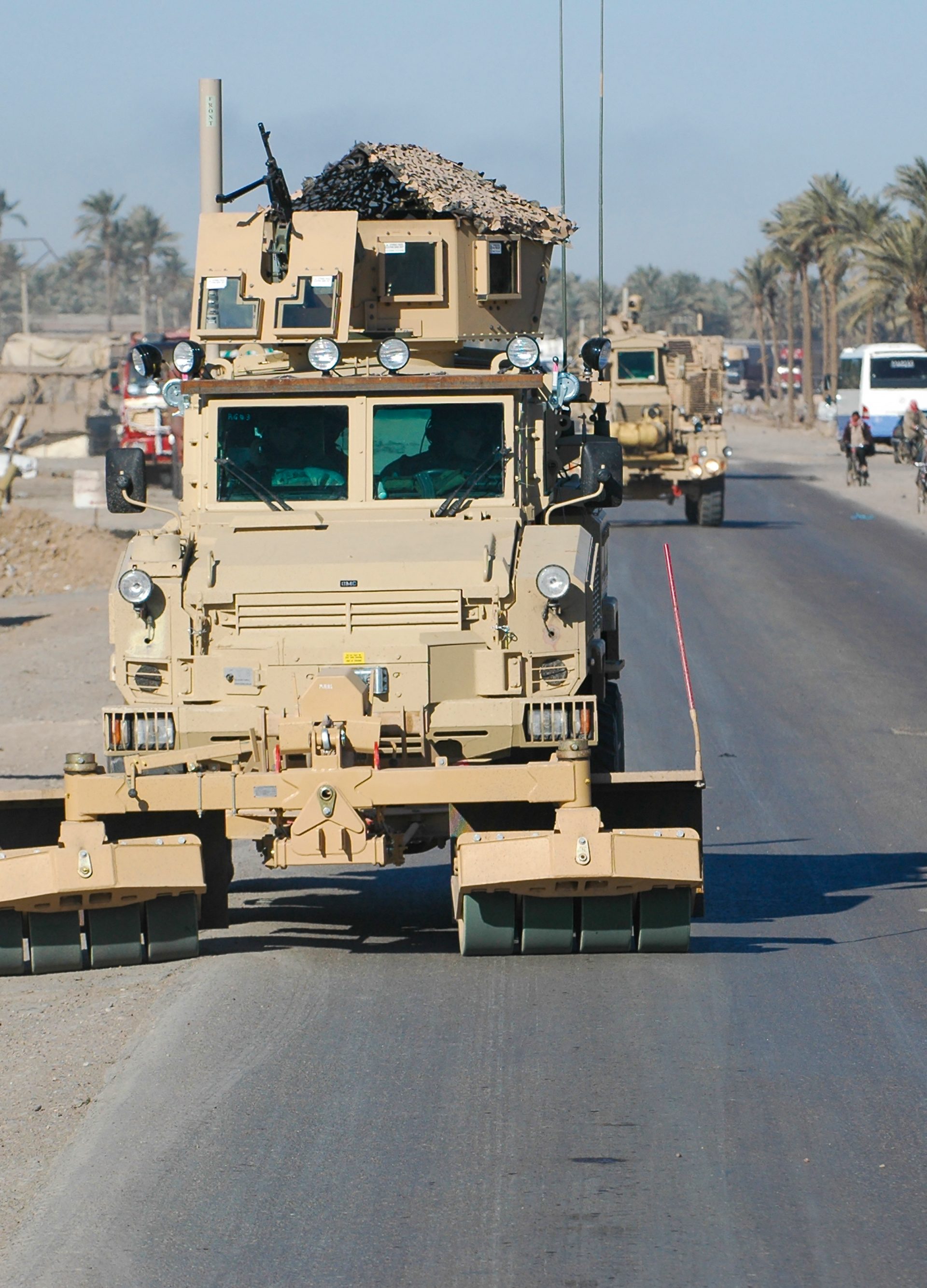 Ground-engaging wheels on a Self Protection Roller are ahead of the vehicle to detonate the threat before the vehicle wheels reach it.